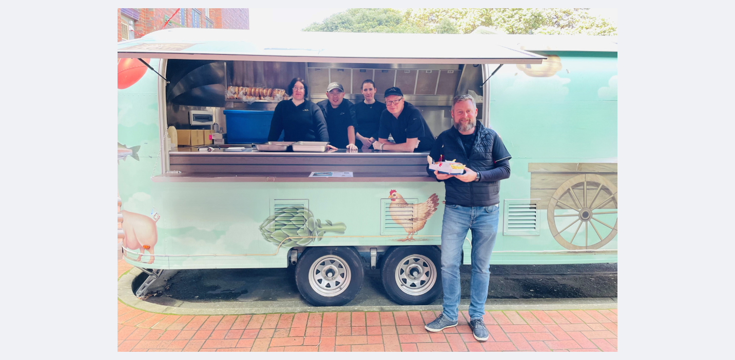 Interislanders pop up caravan with team and customers